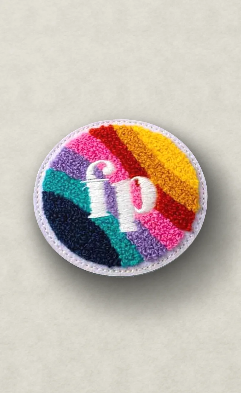 Rainbow Monogram: chenille patch on cream fleece