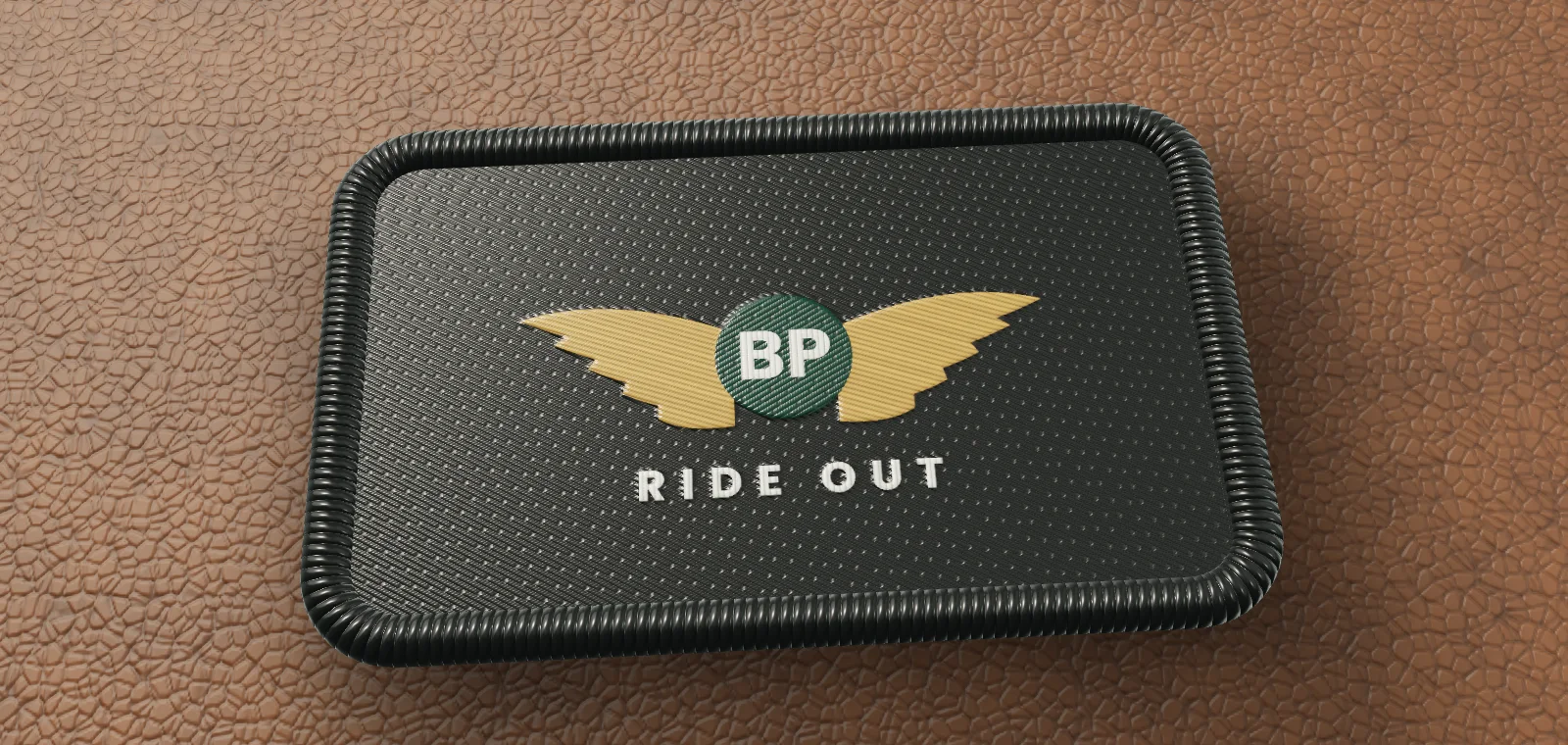 Moto Wings: embroidered patch on tan leather